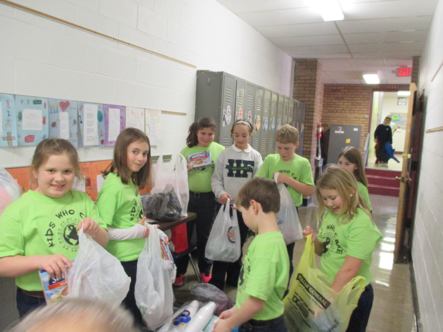 Holy Family School's Kids Who Care group organize gifts for children in need.
